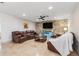 Comfortable living room with stone accent wall, modern furnishings, and tile flooring at 123 Annapolis Ln, Rotonda West, FL 33947