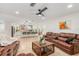 Open-concept living space with tile floors, seamlessly connecting living room and modern kitchen at 123 Annapolis Ln, Rotonda West, FL 33947