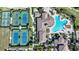 Aerial view of tennis courts and resort style pool at 12425 Ghiberti Cir # 101, Venice, FL 34293