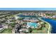 Community with winding waterways, mature landscaping, and community pool at 12425 Ghiberti Cir # 101, Venice, FL 34293