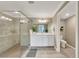 Bathroom featuring a glass shower, white vanity, and tile flooring at 12425 Ghiberti Cir # 101, Venice, FL 34293