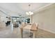 Open concept view of the dining room, living room and kitchen area with neutral colors and abundant natural light at 12425 Ghiberti Cir # 101, Venice, FL 34293