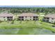 Back view of the property overlooking a serene pond at 12425 Ghiberti Cir # 101, Venice, FL 34293