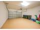 Spacious garage with a clean, painted floor, ample storage space, and an automatic door opener, providing convenience at 12425 Ghiberti Cir # 101, Venice, FL 34293