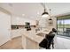 Stylish kitchen with white cabinets, stainless appliances, and a bright, airy feel at 12425 Ghiberti Cir # 101, Venice, FL 34293