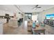Open-concept living room and kitchen area featuring modern furnishings and decor at 12425 Ghiberti Cir # 101, Venice, FL 34293