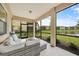 Comfortable screened-in patio area with calming lake scenery at 12425 Ghiberti Cir # 101, Venice, FL 34293