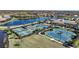 A vibrant community featuring tennis and pickleball courts, pool, and clubhouse, all surrounded by lush landscaping and scenic water views at 12425 Ghiberti Cir # 101, Venice, FL 34293