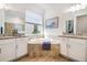 Bathroom featuring double vanities, granite countertops, and a soaking tub at 14684 Cherry Blossom Way, Punta Gorda, FL 33955