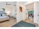 Open doorway to bedroom with ceiling fan and wood-look tile floors at 14684 Cherry Blossom Way, Punta Gorda, FL 33955