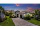 Charming single-Gathering home featuring a paver driveway, well-maintained landscaping, and a tile roof at 14684 Cherry Blossom Way, Punta Gorda, FL 33955