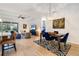 Open-concept living space with a dining area, comfortable seating, and modern decor at 14684 Cherry Blossom Way, Punta Gorda, FL 33955