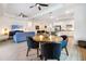 Open concept living space features modern decor, wood-look tile, and abundant natural light at 14684 Cherry Blossom Way, Punta Gorda, FL 33955