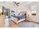 Tranquil main bedroom with a tray ceiling, plenty of light, and access to the pool area at 14684 Cherry Blossom Way, Punta Gorda, FL 33955