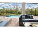 Inviting screened pool with comfortable seating, perfect for relaxation and outdoor entertaining at 14684 Cherry Blossom Way, Punta Gorda, FL 33955