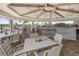 The clubhouse restaurant with bar seating, tables, and views of the community pool offers dining for residents at 14684 Cherry Blossom Way, Punta Gorda, FL 33955