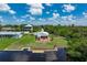 Aerial view of the home showing the waterfront location, dock, and surrounding landscape at 161 Danforth Dr, Punta Gorda, FL 33980