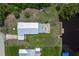 Aerial view of the property showing the house, backyard with fire pit, and private dock at 161 Danforth Dr, Punta Gorda, FL 33980