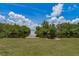Lush backyard with dock and waterfront access at 161 Danforth Dr, Punta Gorda, FL 33980