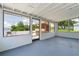 Enclosed patio with views of backyard, outdoor bar, and serene views of nearby waterway at 161 Danforth Dr, Punta Gorda, FL 33980