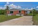 Charming home featuring a covered parking area and well-maintained landscaping at 161 Danforth Dr, Punta Gorda, FL 33980