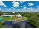 Waterfront property with lush landscaping and a private dock for enjoying the serene surroundings at 161 Danforth Dr, Punta Gorda, FL 33980