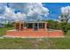 Charming home with a tiki bar on the waterfront patio at 161 Danforth Dr, Punta Gorda, FL 33980