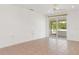 Bright living room with tile flooring and sliding doors to the balcony at 161 Danforth Dr, Punta Gorda, FL 33980