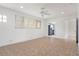 Open living room with tile flooring and an open view to the kitchen at 161 Danforth Dr, Punta Gorda, FL 33980
