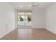 Open-concept living room with tile flooring and a sliding glass door to outdoor space at 161 Danforth Dr, Punta Gorda, FL 33980