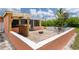 View of the patio featuring the tiki bar, fire pit, and outdoor furniture at 161 Danforth Dr, Punta Gorda, FL 33980