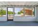 Enclosed patio featuring a painted floor, tongue and groove ceiling, and scenic outdoor views at 161 Danforth Dr, Punta Gorda, FL 33980