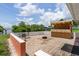Waterfront patio with outdoor table, fire pit, and tiki bar for relaxing and entertaining at 161 Danforth Dr, Punta Gorda, FL 33980