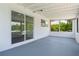 Enclosed patio showcases a painted floor, tongue and groove ceiling, and serene outdoor views at 161 Danforth Dr, Punta Gorda, FL 33980