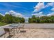 Waterfront patio with outdoor table for relaxing and enjoying the view at 161 Danforth Dr, Punta Gorda, FL 33980