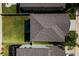 Aerial view of a home showing the roof, fenced yard, neighboring houses and community at 17032 Yellow Pine St, Wimauma, FL 33598