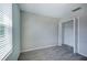 This bedroom offers natural light from the window and ample closet space at 17032 Yellow Pine St, Wimauma, FL 33598