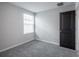 Bedroom featuring carpeted floors and a window bringing in natural light at 17032 Yellow Pine St, Wimauma, FL 33598