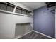 Walk-in closet featuring installed shelving and carpeted floors at 17032 Yellow Pine St, Wimauma, FL 33598