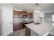 Modern kitchen island, stainless steel appliances and custom backsplash with granite counters at 17032 Yellow Pine St, Wimauma, FL 33598