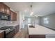 Modern kitchen island and stainless steel appliances, custom backsplash and modern oven at 17032 Yellow Pine St, Wimauma, FL 33598