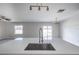 Large kitchen island with sink and stainless steel faucet plus sliding doors to the backyard at 17032 Yellow Pine St, Wimauma, FL 33598