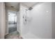 Modern shower featuring tiled walls and a mounted shower head at 17032 Yellow Pine St, Wimauma, FL 33598