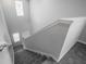 A carpeted staircase that goes up to the second story at 17032 Yellow Pine St, Wimauma, FL 33598