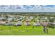 Aerial shot showcasing the home's location and surrounding community at 1915 Pebble Beach Ct, Venice, FL 34293