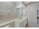 Bathroom with large vanity, single sink, and a neutral countertop at 1915 Pebble Beach Ct, Venice, FL 34293