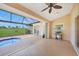Enclosed outdoor space with small pool, grill and view of exterior at 1915 Pebble Beach Ct, Venice, FL 34293