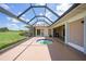 Enclosed patio featuring a unique octagonal pool and serene outdoor setting at 1915 Pebble Beach Ct, Venice, FL 34293