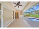 Enclosed outdoor space with small pool and storage cabinet at 1915 Pebble Beach Ct, Venice, FL 34293