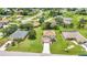 An aerial view highlights the home's location, manicured lawn, landscaping, and community at 200 Valdiva St, Punta Gorda, FL 33983